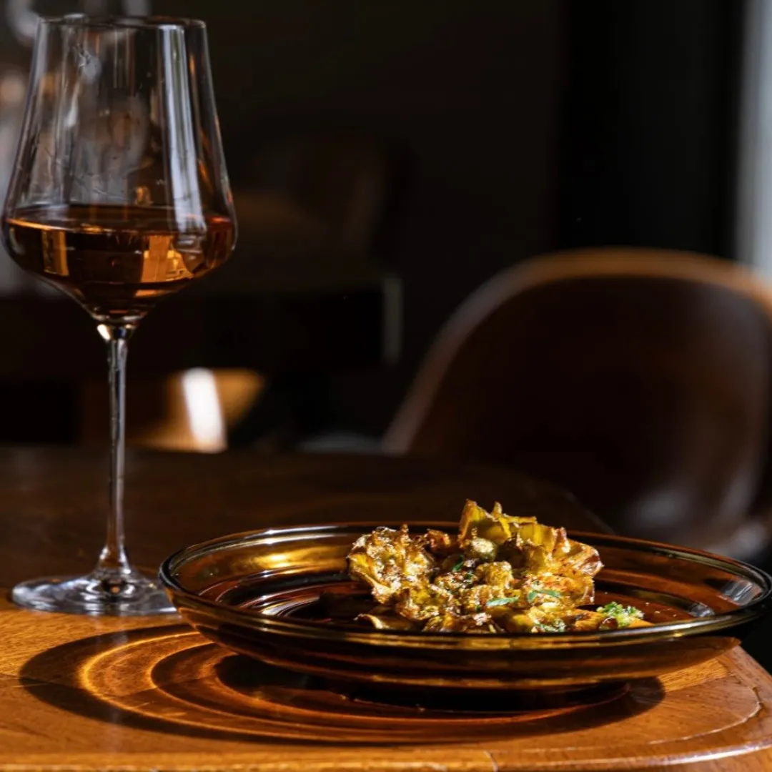 Golden dish with wine